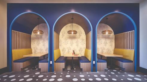 Modern booths with bold blue and yellow colors