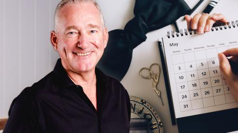 Man's headshot in front of yearly calendar stock photo