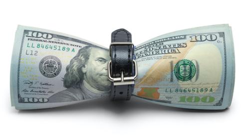 One-hundred dollar bills tightened by belt