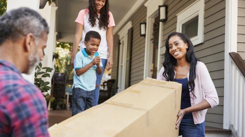 Family moving into suburban home