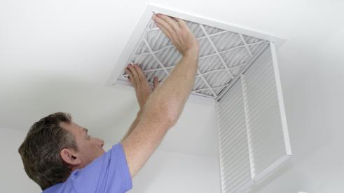 Person installing air filter