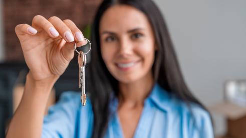 woman holding house key