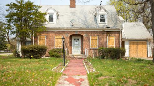 Boarded up old house ripe for a buyer and renovation