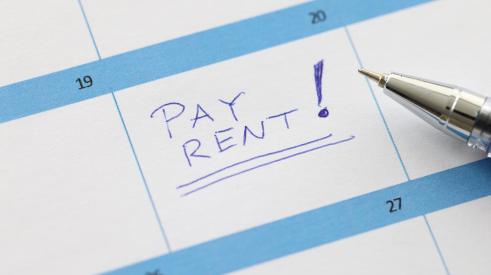 A calendar says pay rent.