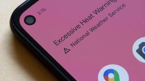 A phone shows an Extreme Heat Warning.