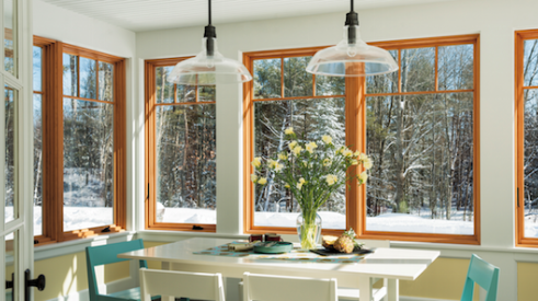 The large expanse of Andersen Windows in this kitchen connect the space to the outdoors