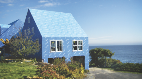 Henry Blueskin VP100 air barrier membrane installed on a house by the coast