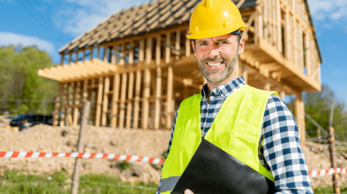Pro Builder's 2024 forecast shows home builders are optimistic like this smiling builder on the jobsite
