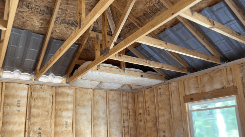 Home attic insulation batts installed in areas hard to reach 