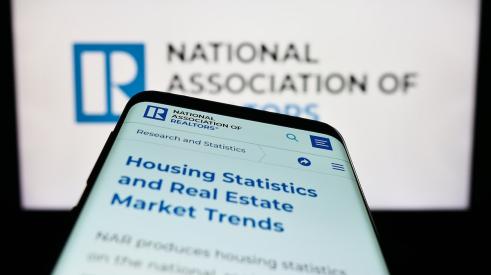 National Association of Realtors webpage on computer and phone