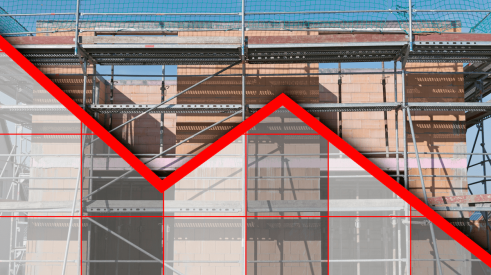 New-home construction with red downward chart line superimposed