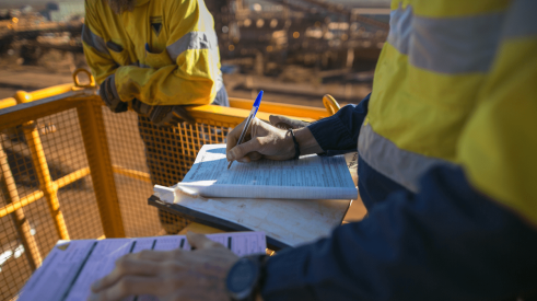 Completing a form on a construction jobsite