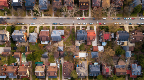 Aerial view of older single-family homes that need better energy efficiency