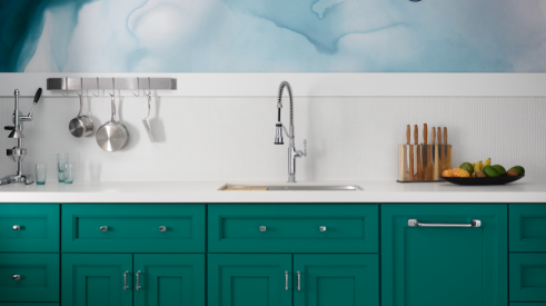 Green kitchen cabinets, modern faucet, Image: Courtesy Kohler