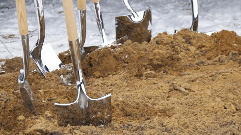 Shovels in dirt for groundbreaking ceremony