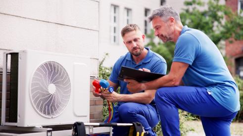 Technicians checking HVAC system faults