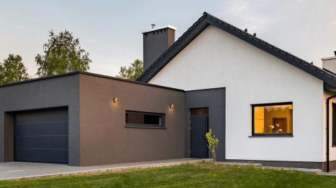 Value-engineered home exterior with minimalist styling on the facade