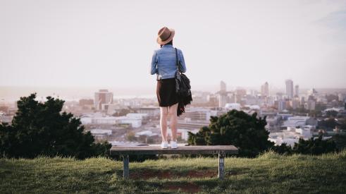 Woman overlooking cityscape