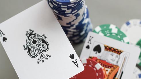 Ace and king cards with poker chips