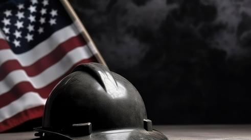 Black hard hat with American flag in background