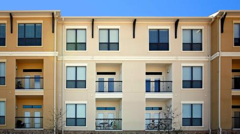 Exterior of multifamily apartment building with balconies