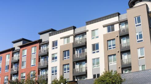 Exterior of multifamily apartment building with stucco finish