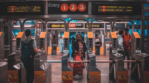 NYC subway passing through turnstiles