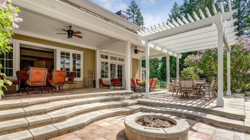 Home backyard with fire pit and gazebo