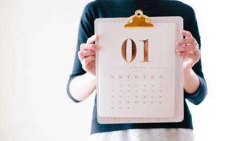 Woman holding up January 2019 calendar