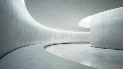 Concrete hallway with curved wall