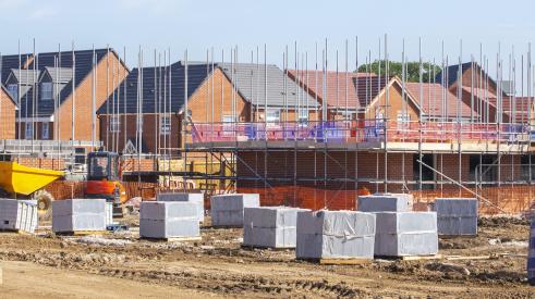 Construction site with houses under frame