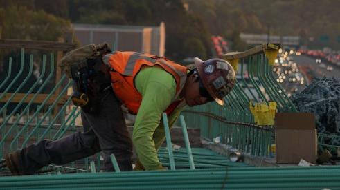 Construction worker installing rebar on a jobsite