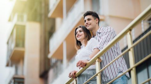 Couple on balcony looking out