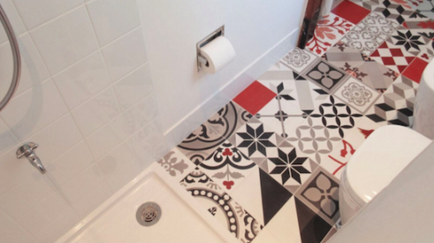 Colorful, whimsical floor tile makes this white bathroom by Studio Habeas Corpus pop. The project won a honorable mention in the Duravit Designer Dream Bath Competition. 