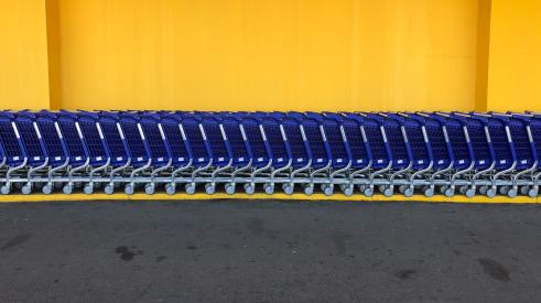 Shopping carts in front of yellow building