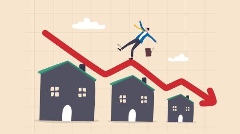 Businessman standing on falling red arrow above levels of homes