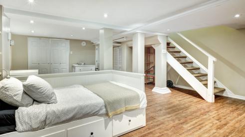 Spacious and bright finished basement with daybed