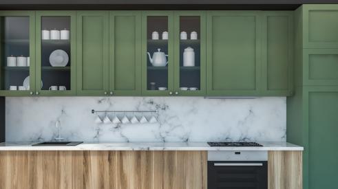 Modern kitchen with marble countertops and green cabinets