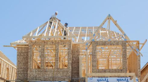 Builders on wood-framed new house