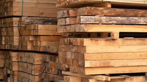 Stacks of lumber pallets in warehouse