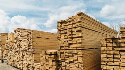 Lumber stacked in lumberyard as lumber prices continue to rise