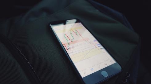 Phone with stock market data on screen