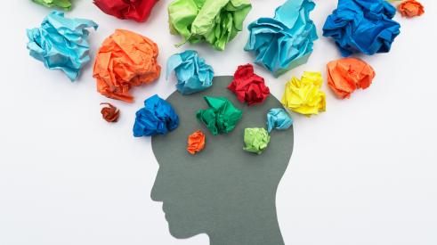 Mental health, silhouette of head with crumbled colored paper
