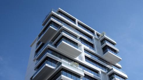 Multifamily apartment building with blue sky