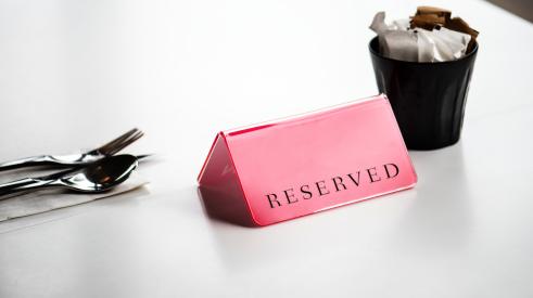 Reserved label on a dining table