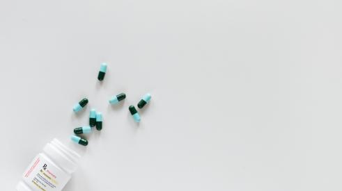 Pills falling out of pill bottle