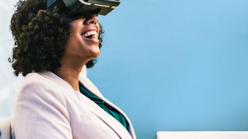Woman sitting with VR headwear on