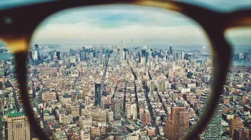 Glasses overlooking cityscape