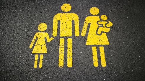 Painted pedestrian sign of family