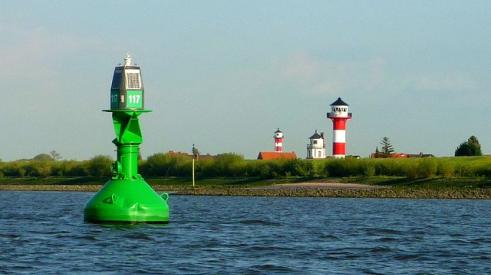 Bouy and light house in harbor